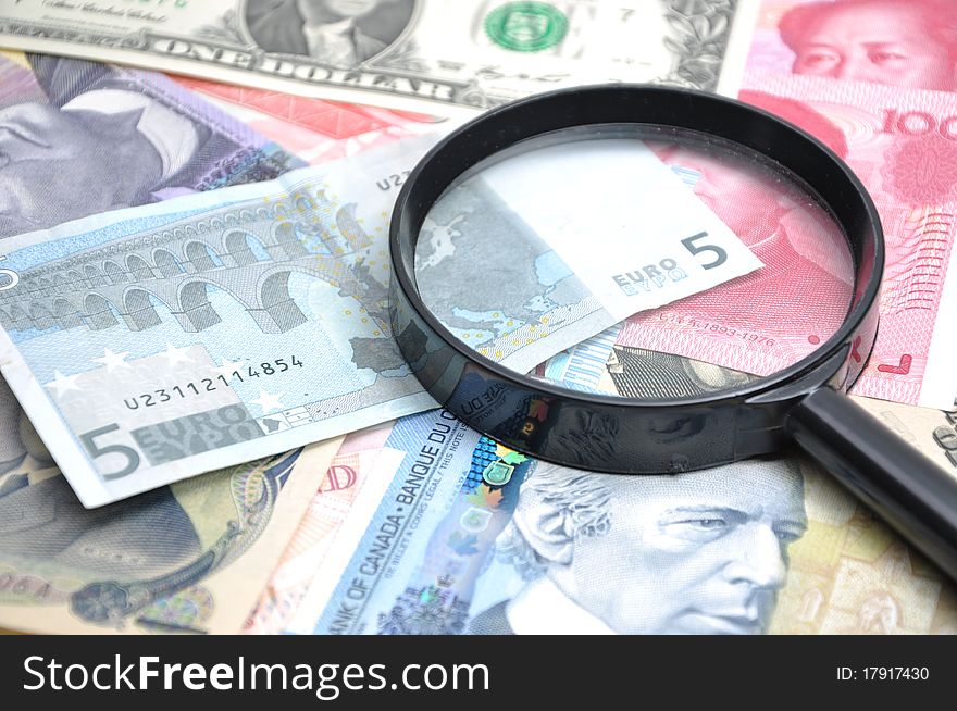 Seeking fake bill with Magnifying glass