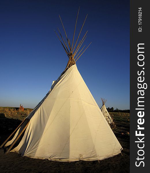 Tipis or teepees in a field in Autumn. Tipis or teepees in a field in Autumn