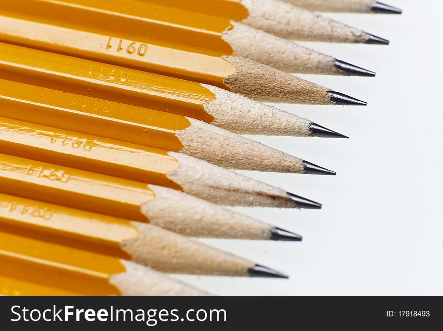 No 2 graphite pencils isolated on a white desk. No 2 graphite pencils isolated on a white desk