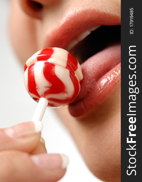 Girl Licking A Lollipop