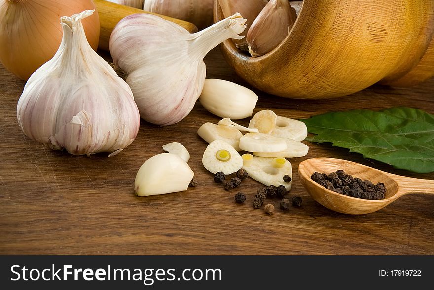 Garlic and healthy food on wooden