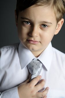 Schoolboy Arranging Tie Stock Photos