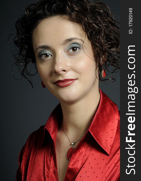 Caucasian elegant  business woman posing with red accessories in studio. Caucasian elegant  business woman posing with red accessories in studio