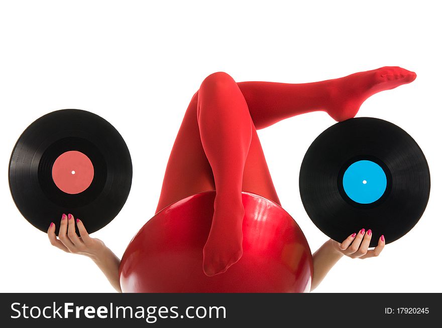 Female feet with vinyl record isolated in white