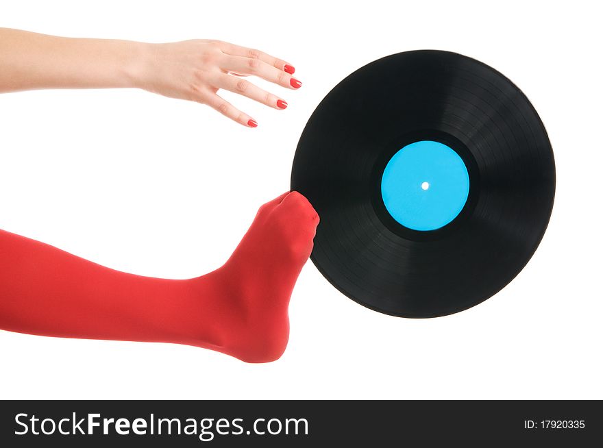 Female feet with vinyl record isolated in white