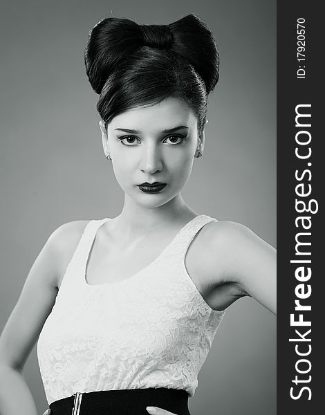 Elegant fashionable woman with a bow hairstyle