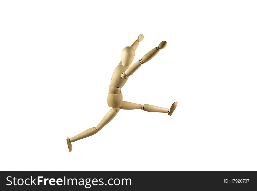 Wooden figure jumping on a white background. Wooden figure jumping on a white background.