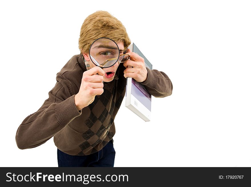 Guy with glasseslooking into the camera, holding a magnifier. Guy with glasseslooking into the camera, holding a magnifier