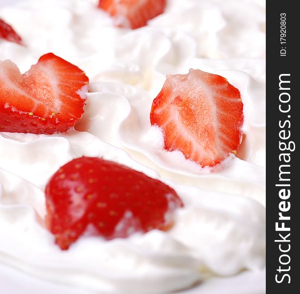 Fresh strawberries on cream close-up shot. Fresh strawberries on cream close-up shot