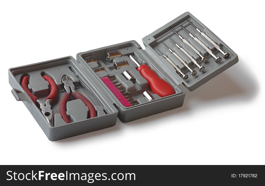 A set of tools in the box. Screwdrivers, wire cutters, pliers. Isolated.