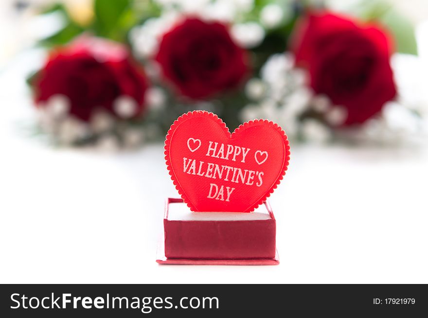 Red roses with Valentine heart on white. Red roses with Valentine heart on white