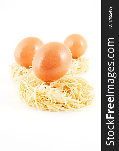 Eggs and noodles isolated on white background (selective focus)