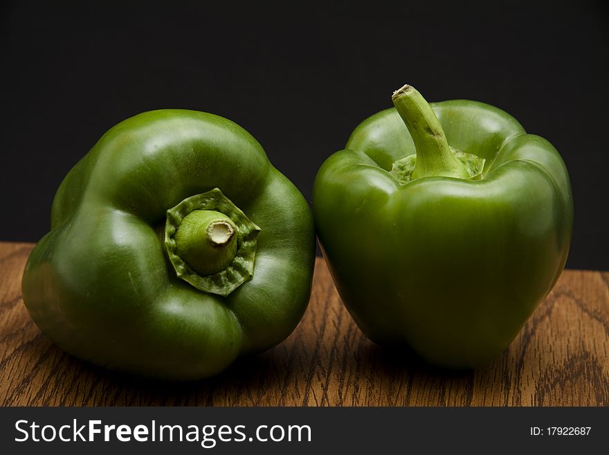 Paprika on kitchen table and black background turns green. Paprika on kitchen table and black background turns green