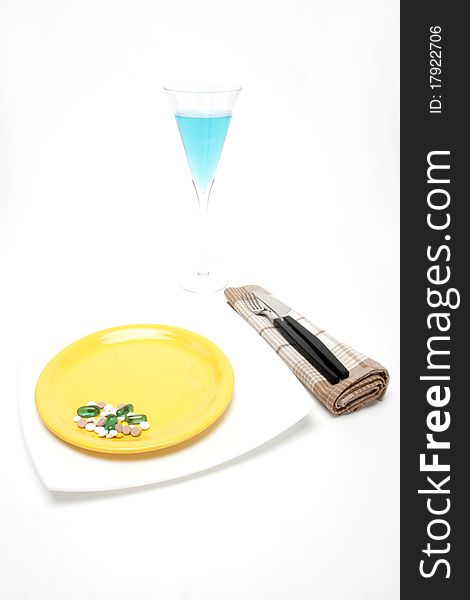 Place setting with plateand and pills. Place setting with plateand and pills