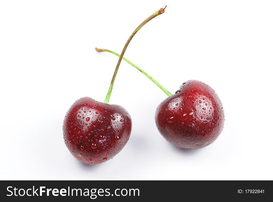 There are two cherry with drop of water. There are two cherry with drop of water
