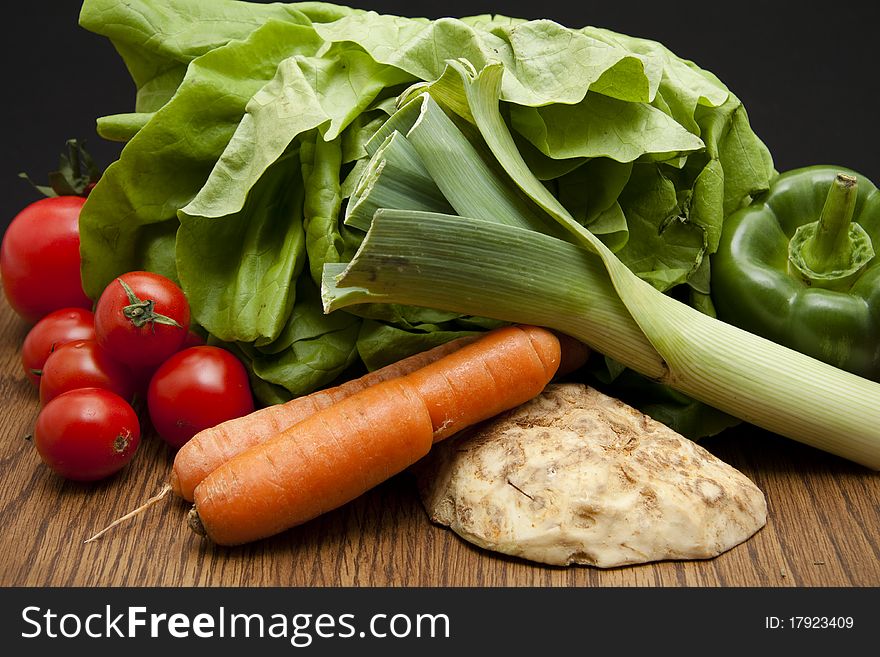 Head lettuce with leek, tomato, carrot and celery. Head lettuce with leek, tomato, carrot and celery