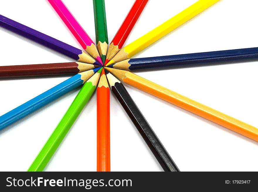 Assortment of coloured pencils on white background. Assortment of coloured pencils on white background