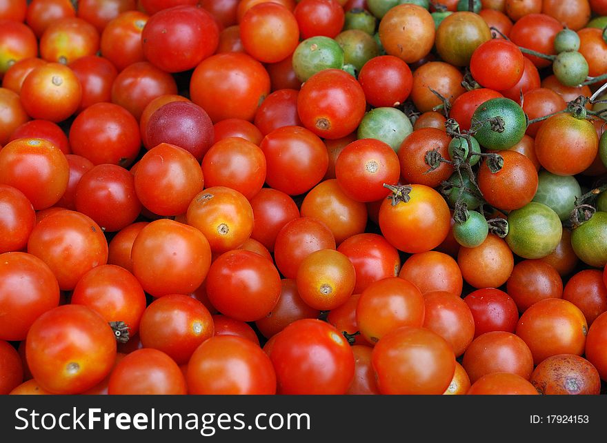 A Stack or Pile of Red Tomatoes