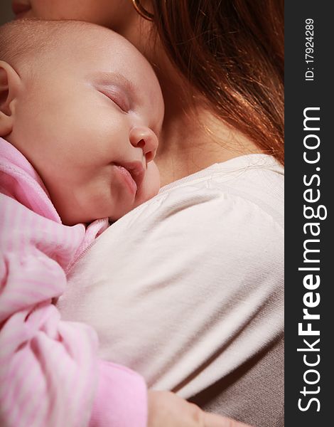 Little baby asleep on mother's chest. Little baby asleep on mother's chest