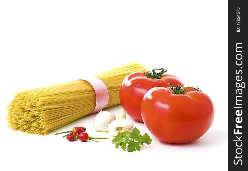 Tomatoes, garlic, peppers, basil and spaghettis. Tomatoes, garlic, peppers, basil and spaghettis