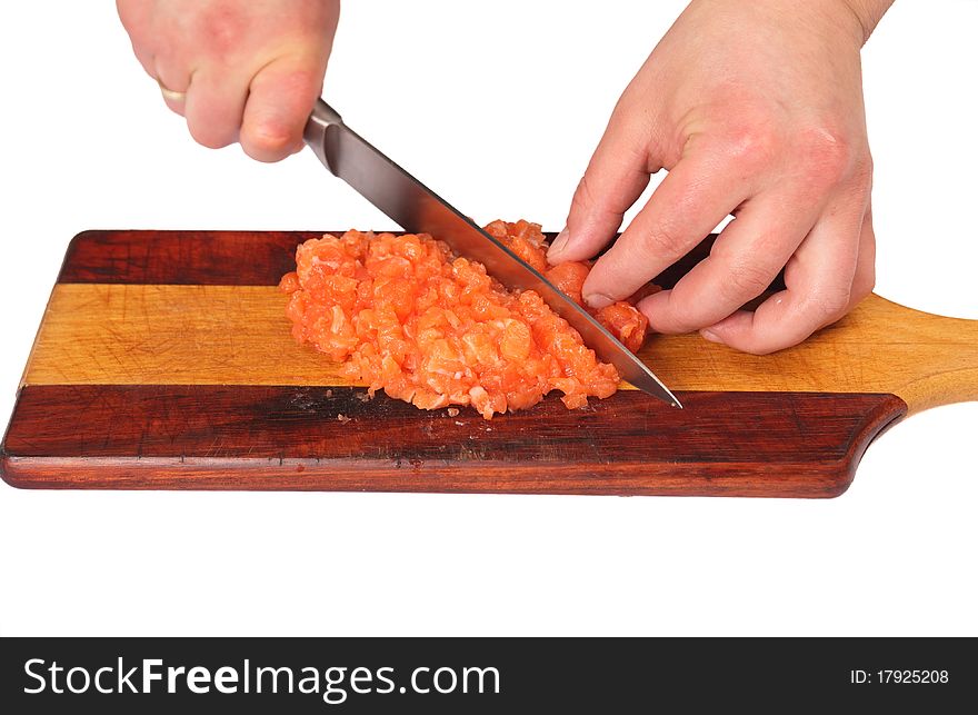 Cook cutting fresh salmon fillet. Cook cutting fresh salmon fillet