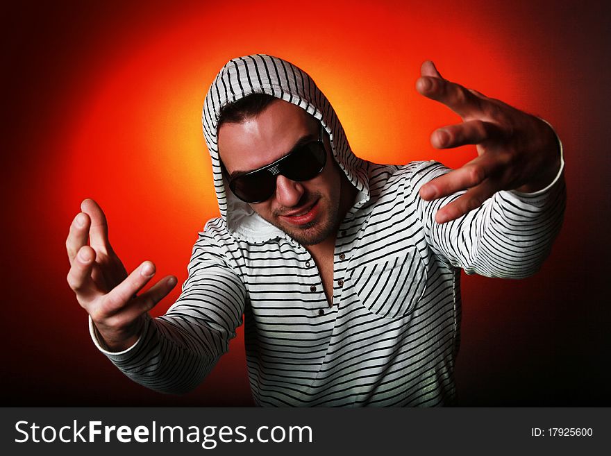 Funny-looking guy in hoody showing hands