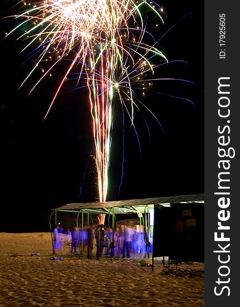 Night beach party with firework