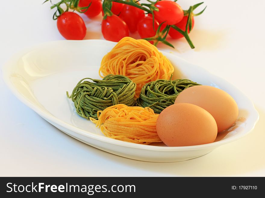 Italian pasta of hay and straw with white background