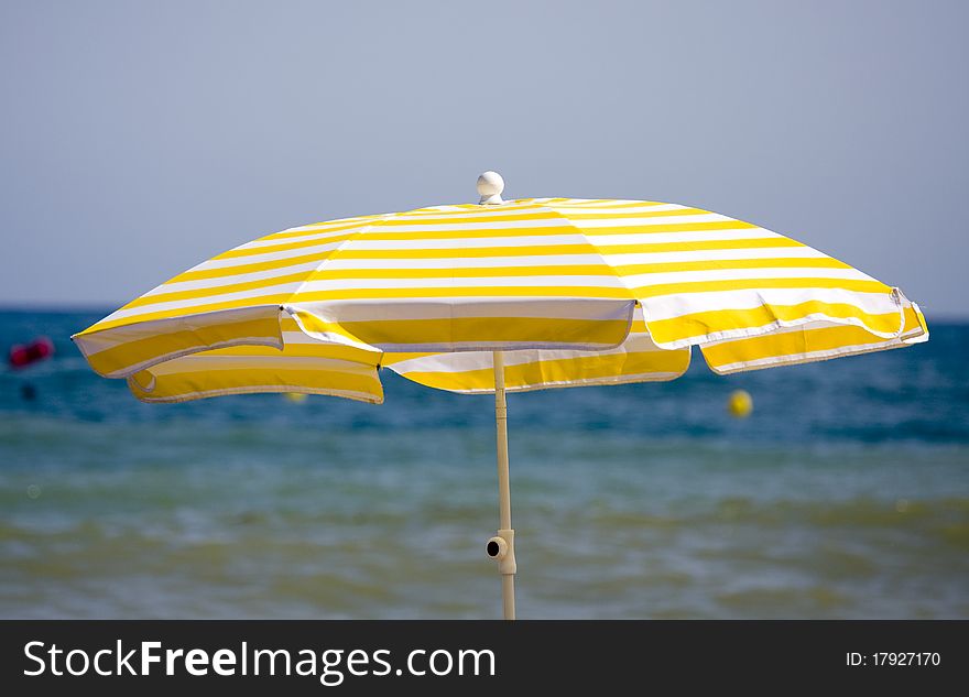 Colorful beach umbrella protecting of sun light