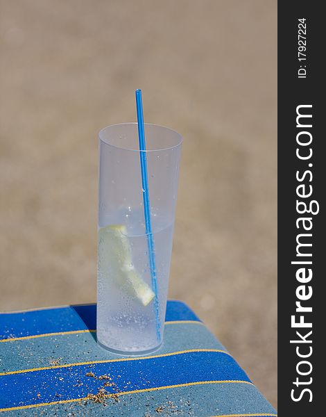 Drink on the beach in plastic glass