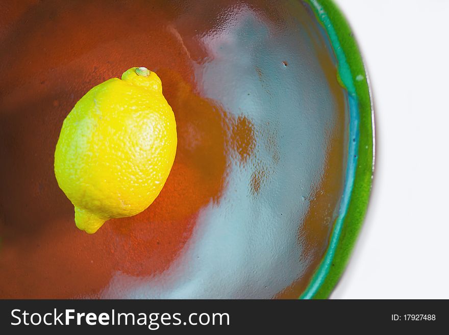 Yellow lemon colorful bowl white background