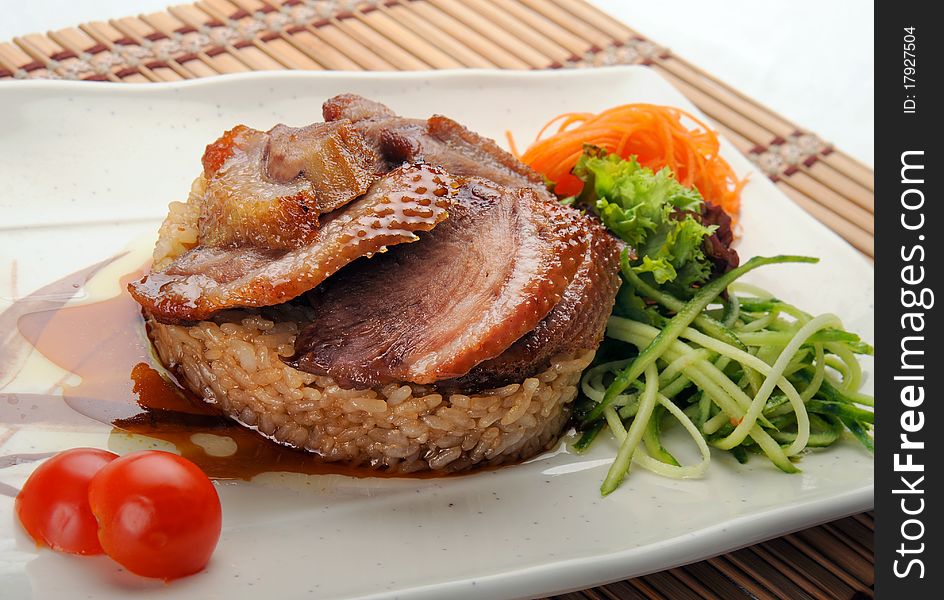 Roast duck with rice, sweet sauce and vegetables. Roast duck with rice, sweet sauce and vegetables