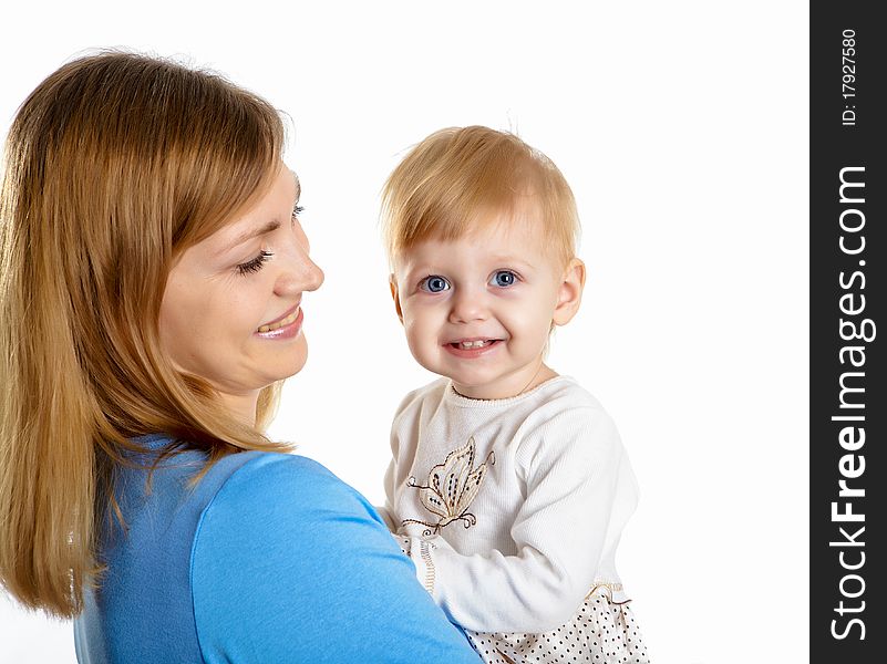 Young mother having fun with her little son on the floor