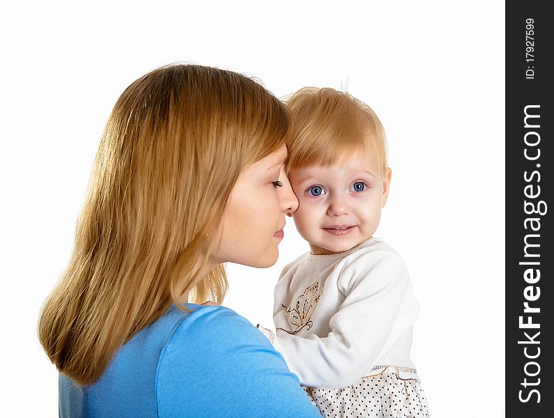 Young mother having fun with her little son on the floor