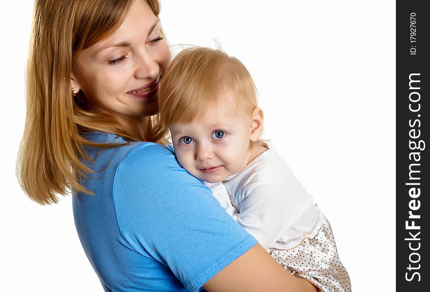 Young mother having fun with her little son on the floor