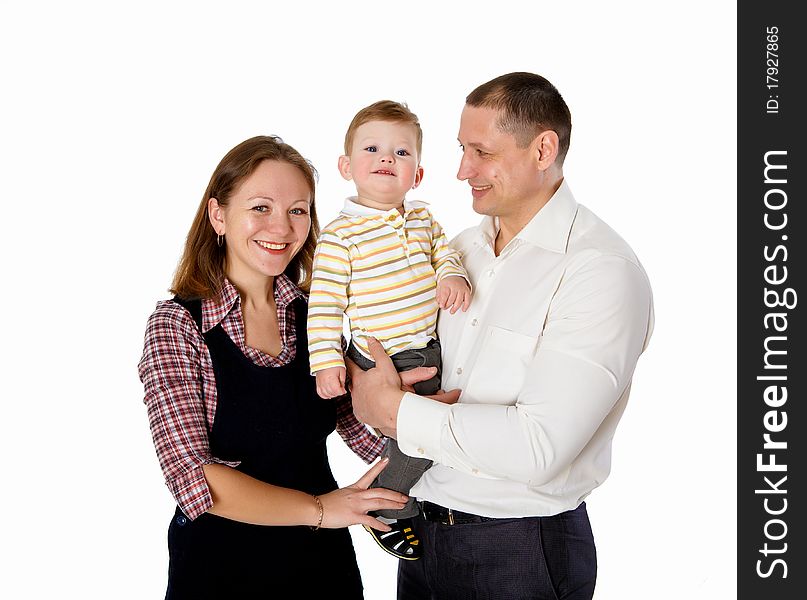 Portrait of mother, father and their child together in studio