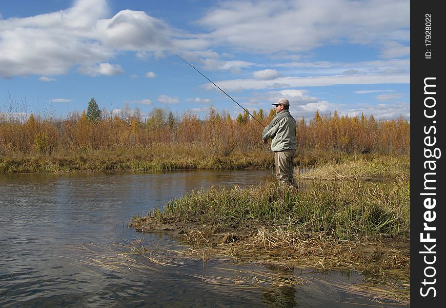 Fishing - fisherman catched fishes on river