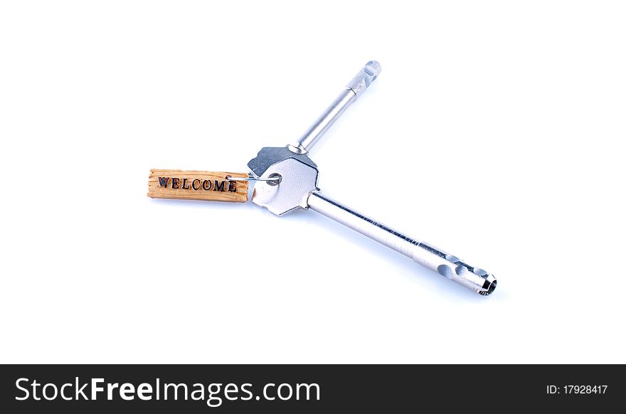 Welcome concept with key and label isolated on white. Welcome concept with key and label isolated on white