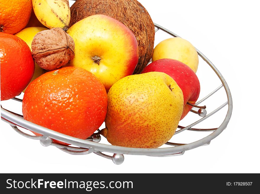 Fruit in a metal basket isolated