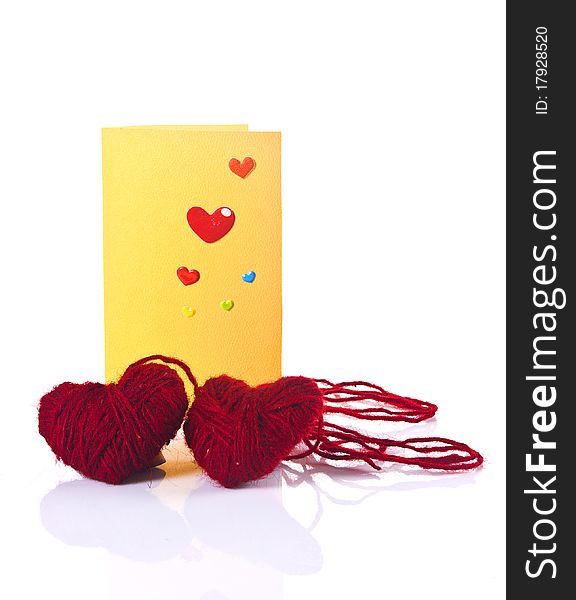 Two crewel red hearts, yellow greeting template,. Two crewel red hearts, yellow greeting template,