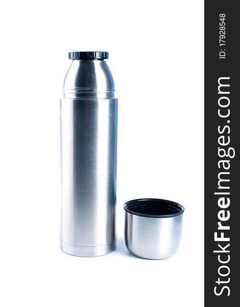 Metal thermos for preservation of a hot or cold liquid on a white background. Metal thermos for preservation of a hot or cold liquid on a white background.