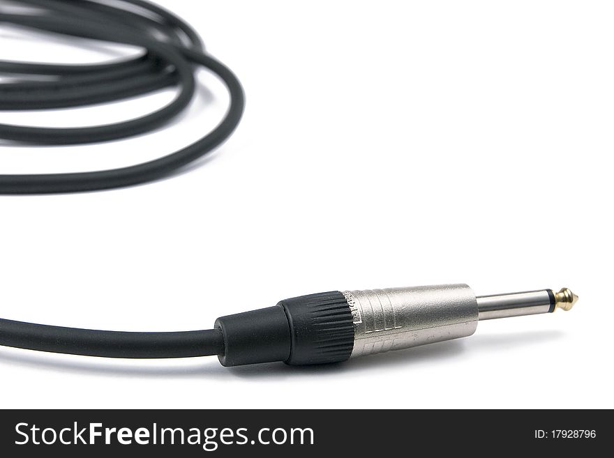 Black musical cable for bass guitar with one metal shiny jack. Black musical cable for bass guitar with one metal shiny jack