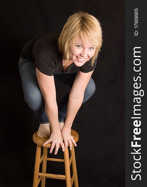 young woman on stool