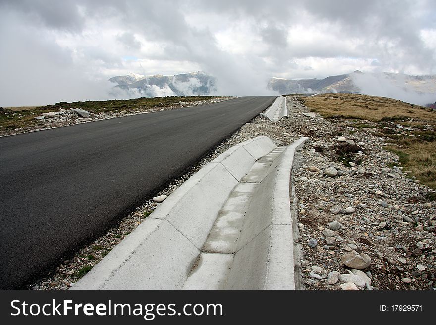 Damaged road in the mountains. Damaged road in the mountains