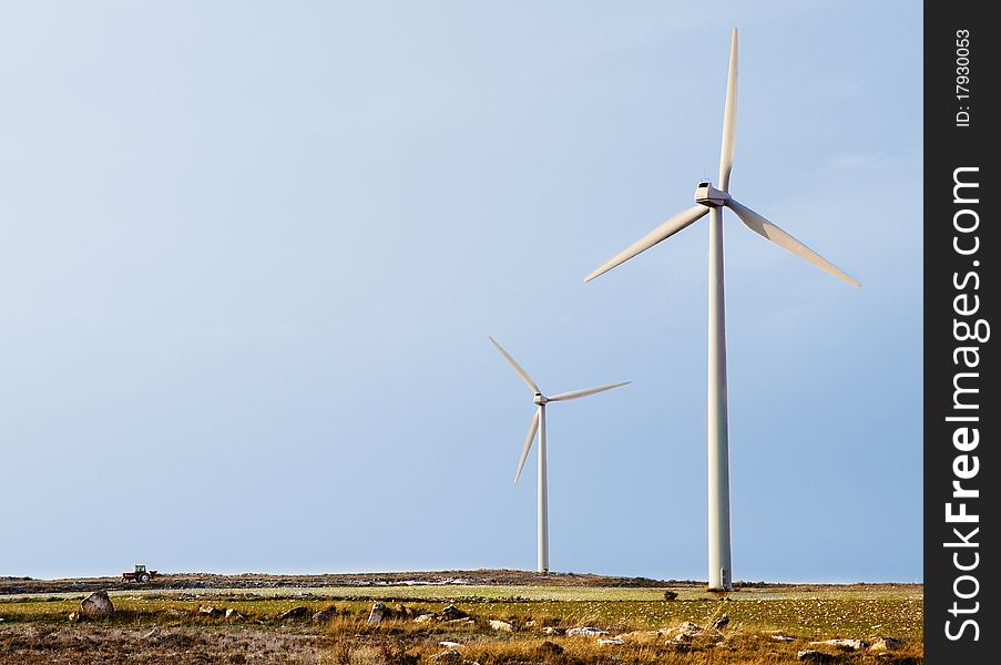 Landscape of wind turbines and little tractor