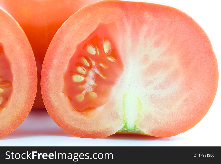 Section of tomato isolated on white