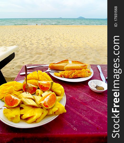 Snack of fruit and sandwich by the sea. Snack of fruit and sandwich by the sea