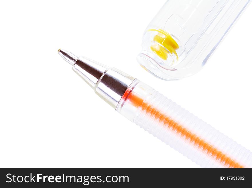 Closeup of yellow ballpoint pen and cap isolated on white