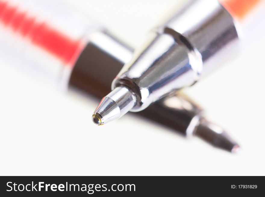 Closeup Of Red And Orange Ballpoint Pens