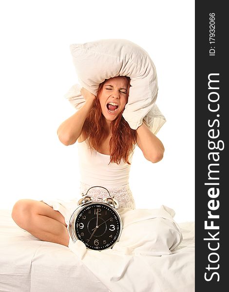 Young woman lying in bed with alarm clock. Young woman lying in bed with alarm clock